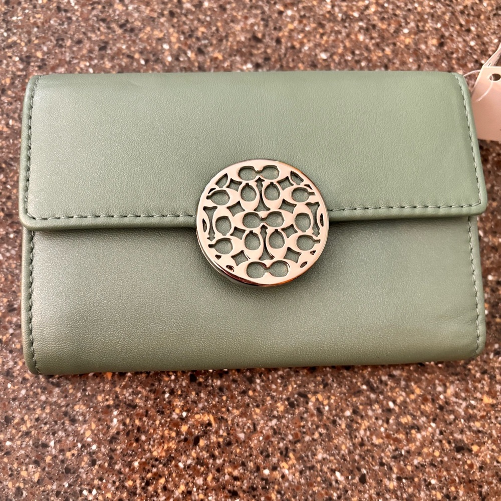 NWT Coach ladies wallet, mint green w/silver hardware. A lot of room!